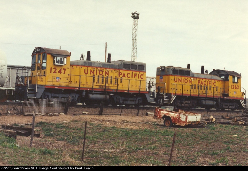 A pair of switchers shuffle cars